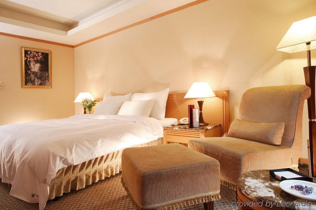 Hotel Dion Tchaj-čung Pokoj fotografie